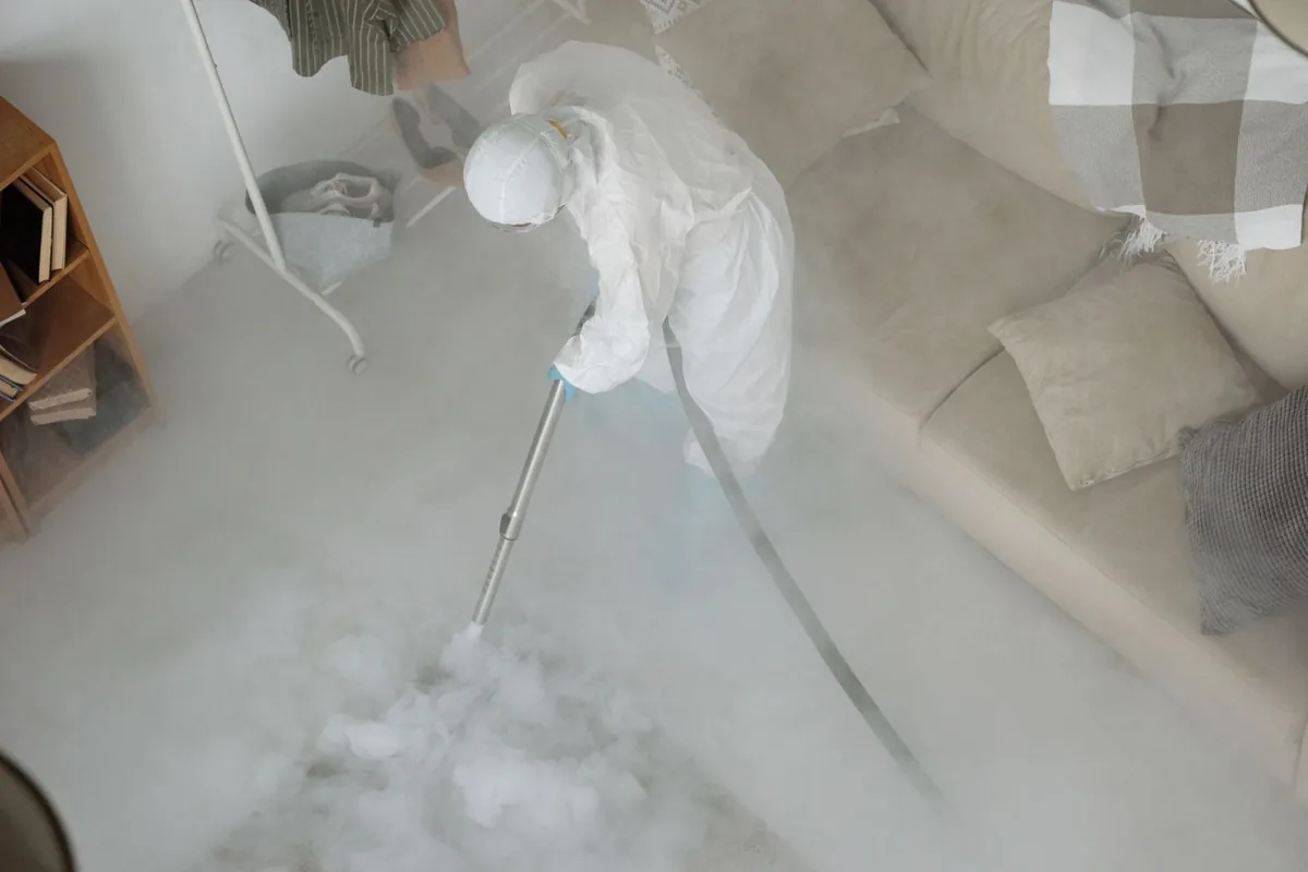 Biohazard cleanup technician in protective equipment, Lake Koshkonong, WI